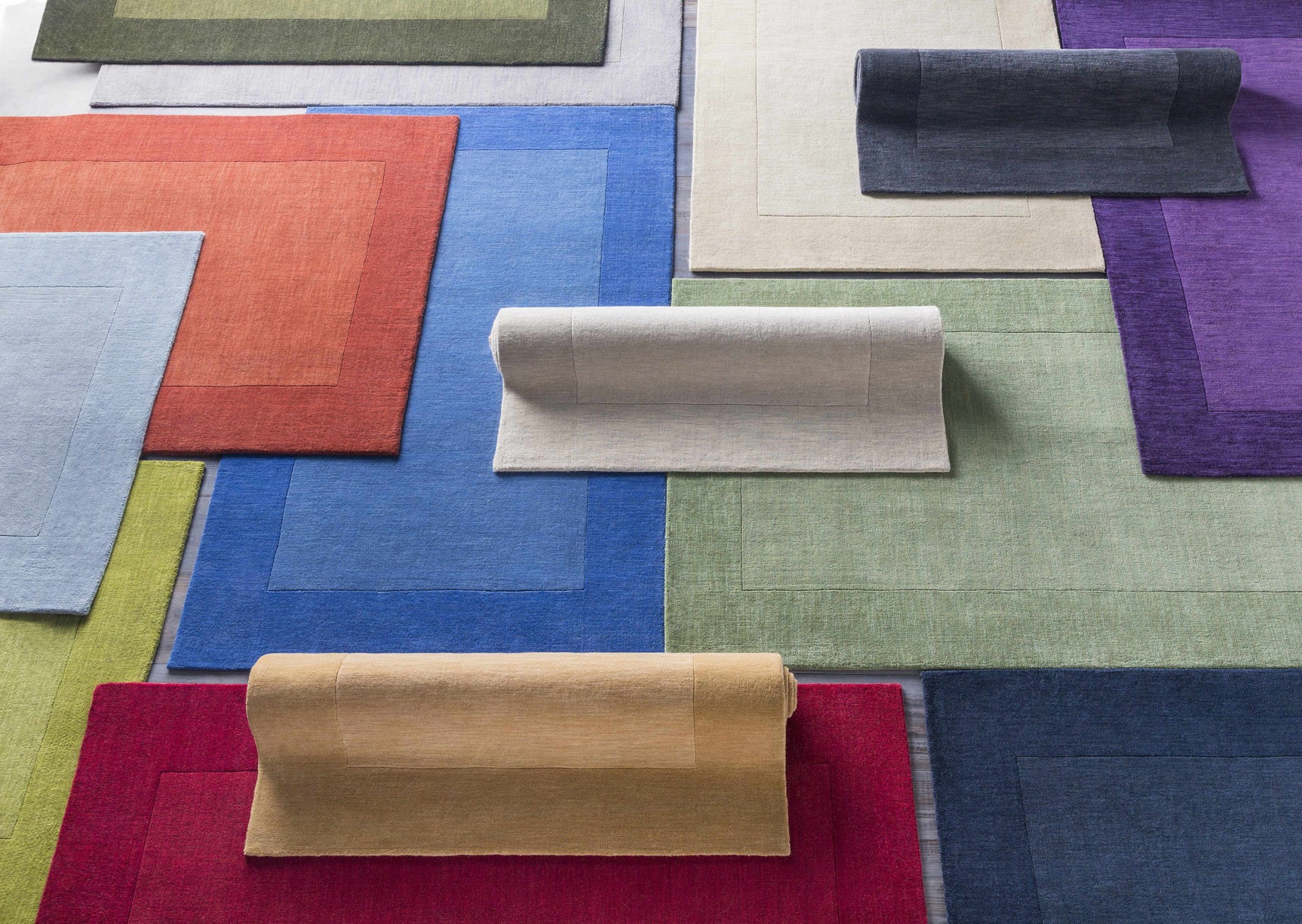Arkabutla Solid Blue Bordered Wool Rug - Ornate Home