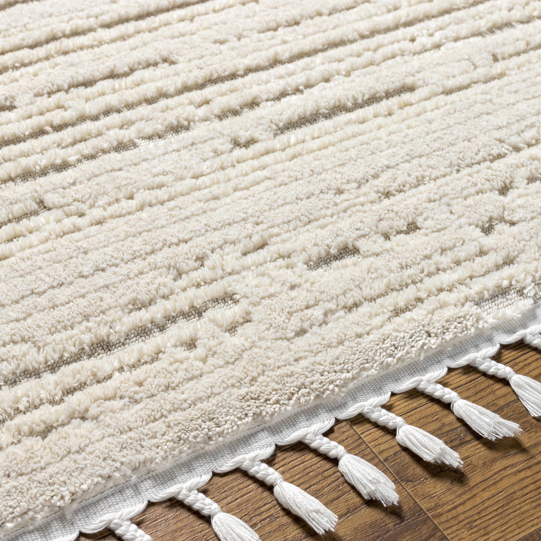 Ibarra Textured Ivory High/Low Pile Rug with Tassels - Ornate Home