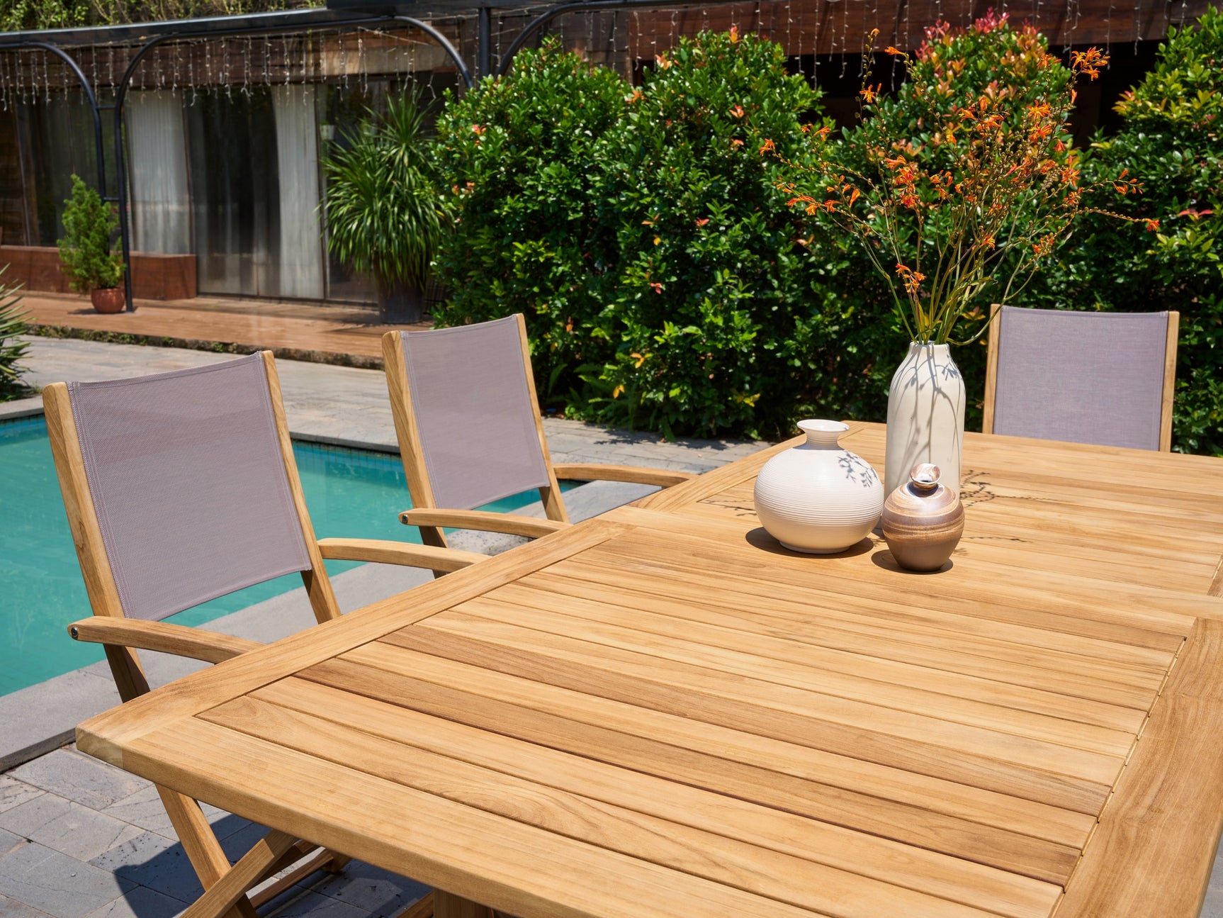 Ihland Rectangular Teak Outdoor Dining Table with Double Extensions and Umbrella Hole - Ornate Home