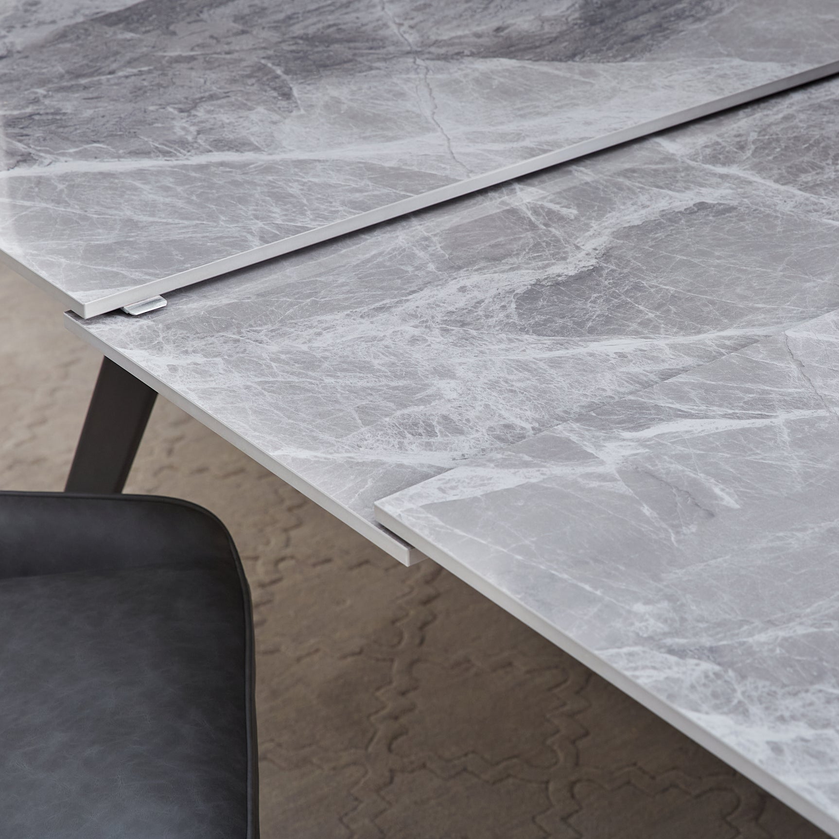 Lucia Extendable Stone Top Metal Leg Dining Table in Piedra and Black - Ornate Home