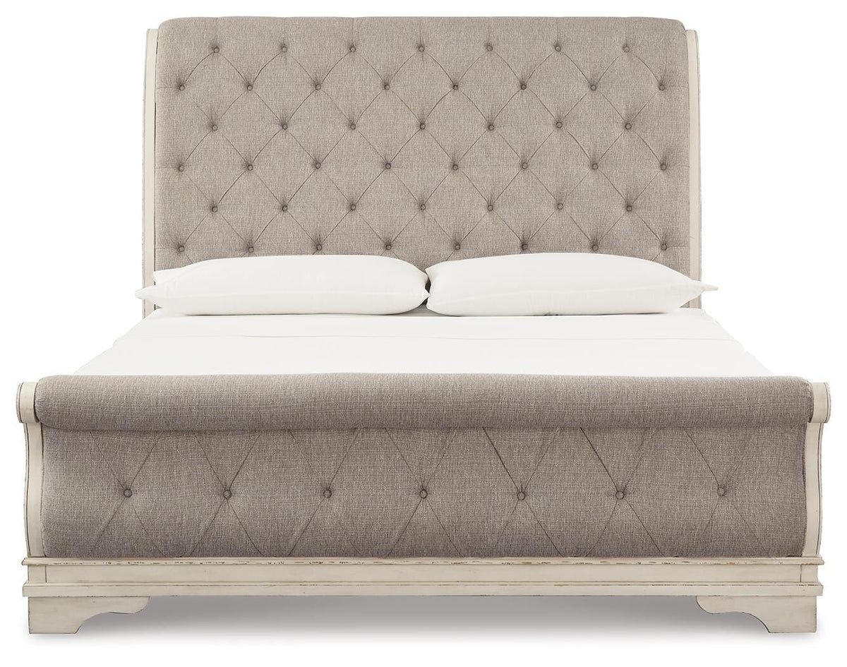 Realyn Chipped White King Upholstered Sleigh Bed, Dresser and Nightstand - Ornate Home