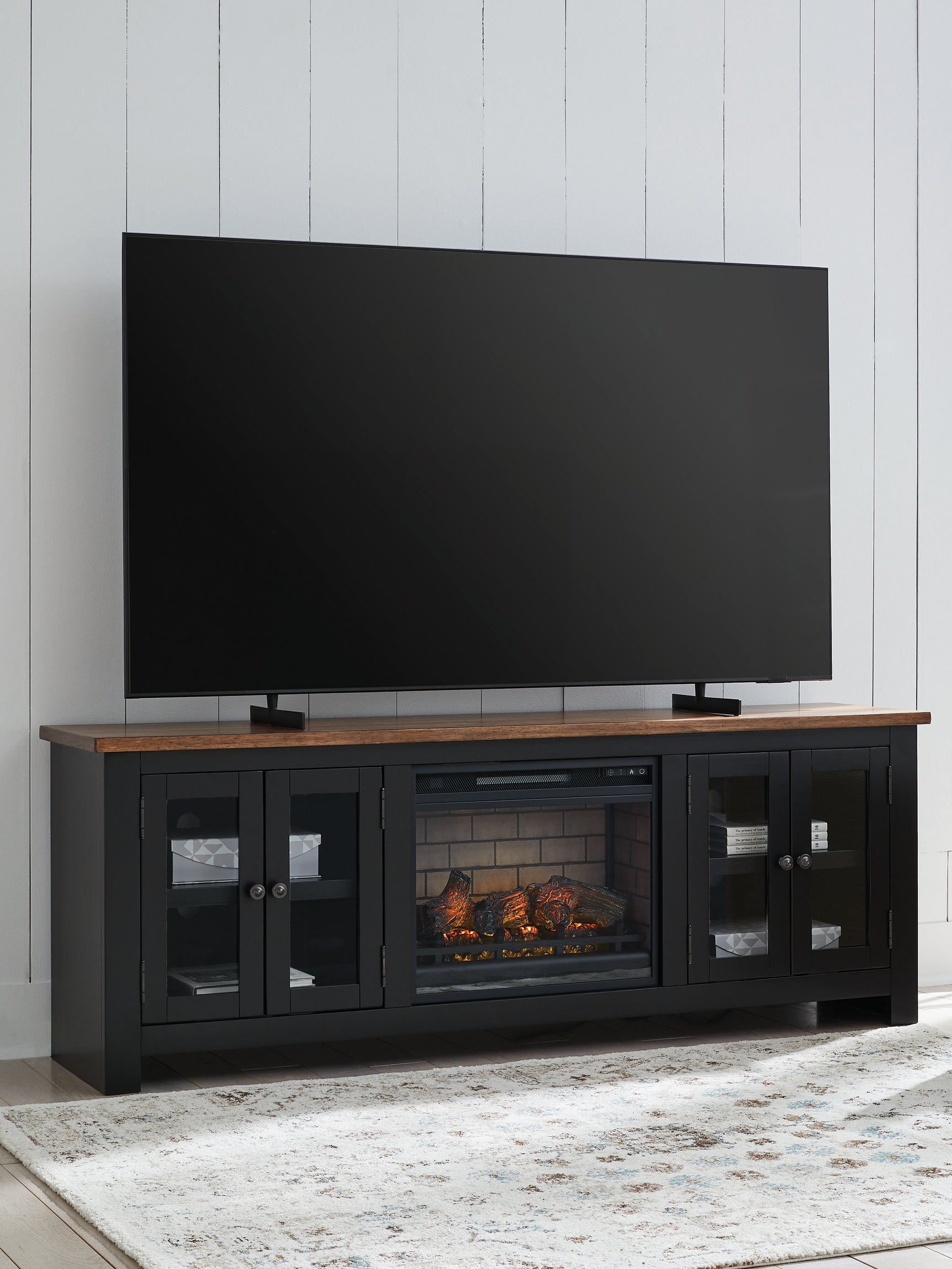 Wildenauer Brown/Black 76" TV Stand with Electric Fireplace (realistic-looking log) - Ornate Home