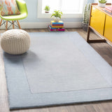 Arkabutla Solid Blue Bordered Wool Rug - Ornate Home