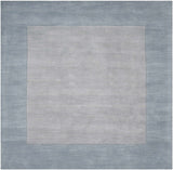 Arkabutla Solid Blue Bordered Wool Rug - Ornate Home