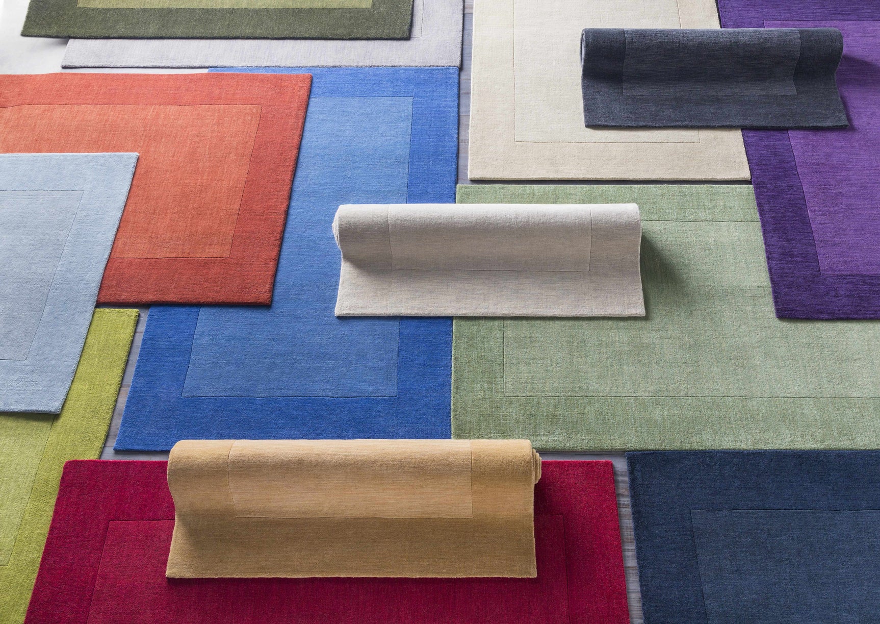 Arkabutla Solid Blue Bordered Wool Rug - Ornate Home
