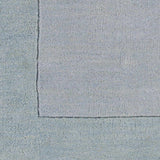 Arkabutla Solid Blue Bordered Wool Rug - Ornate Home