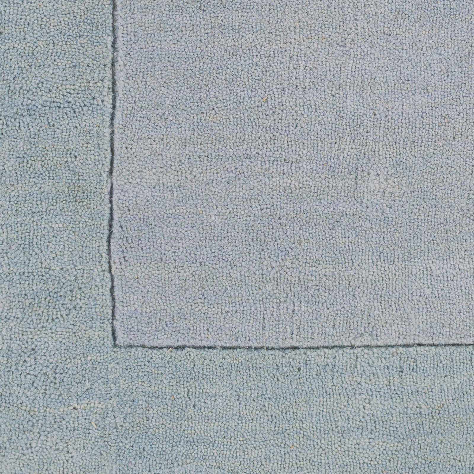 Arkabutla Solid Blue Bordered Wool Rug - Ornate Home