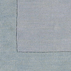 Arkabutla Solid Blue Bordered Wool Rug - Ornate Home