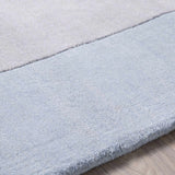 Arkabutla Solid Blue Bordered Wool Rug - Ornate Home