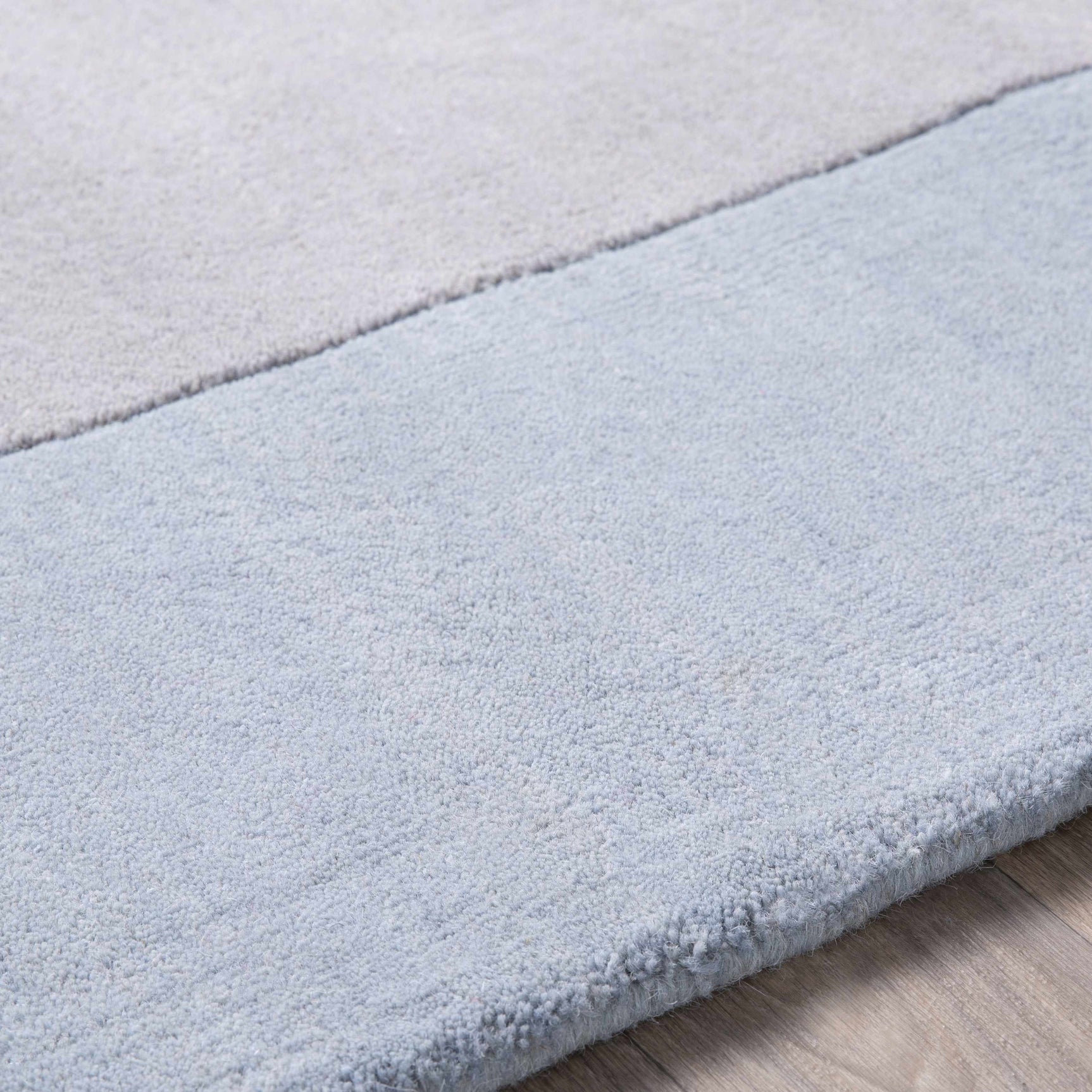 Arkabutla Solid Blue Bordered Wool Rug - Ornate Home