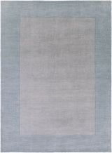 Arkabutla Solid Blue Bordered Wool Rug - Ornate Home