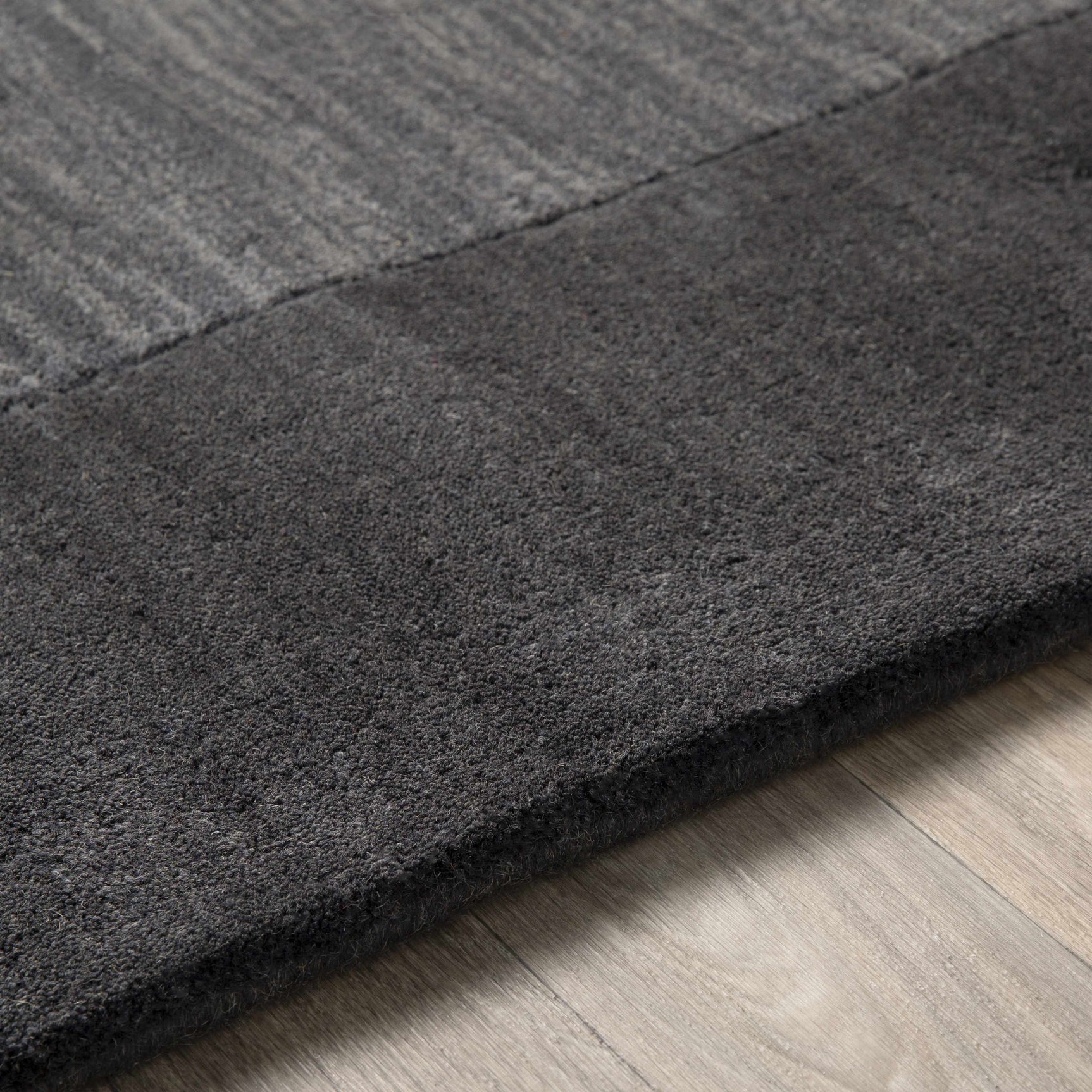 Bordered Solid Black Charcoal Wool Rug - Ornate Home