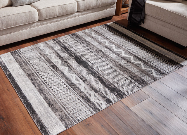 Henchester Multi 5' x 7' Rug - Ornate Home