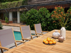 Ihland Rectangular Teak Outdoor Dining Table with Double Extensions and Umbrella Hole - Ornate Home