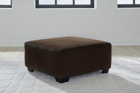 Kimlee Chocolate 3-Piece Sectional and Ottoman - Ornate Home