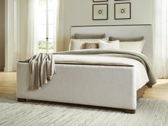 Radkin Burnished Brown Queen Upholstered Panel Bed - Ornate Home
