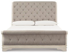 Realyn Chipped White King Upholstered Sleigh Bed, Dresser and Nightstand - Ornate Home