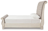Realyn Chipped White King Upholstered Sleigh Bed, Dresser and Nightstand - Ornate Home