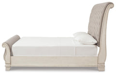 Realyn Chipped White King Upholstered Sleigh Bed, Dresser and Nightstand - Ornate Home