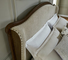 Sturlayne Brown California King Upholstered Panel Bed - Ornate Home
