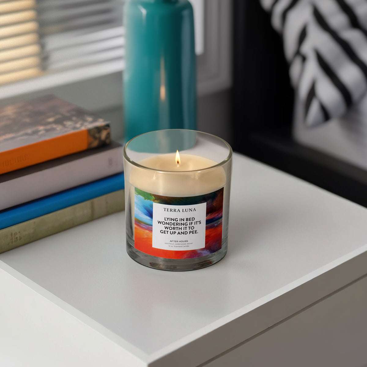 Spangler Orange/Blue/Black Lying in Bed Lidded Candle