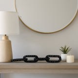 Caseyley Black Pierced Metal 4-Chain Link Object